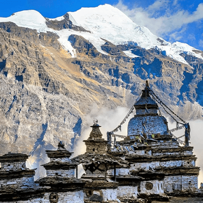 A Buddhist temple nestled amidst snow-capped mountains, showcasing the serene beauty of nature and spirituality.